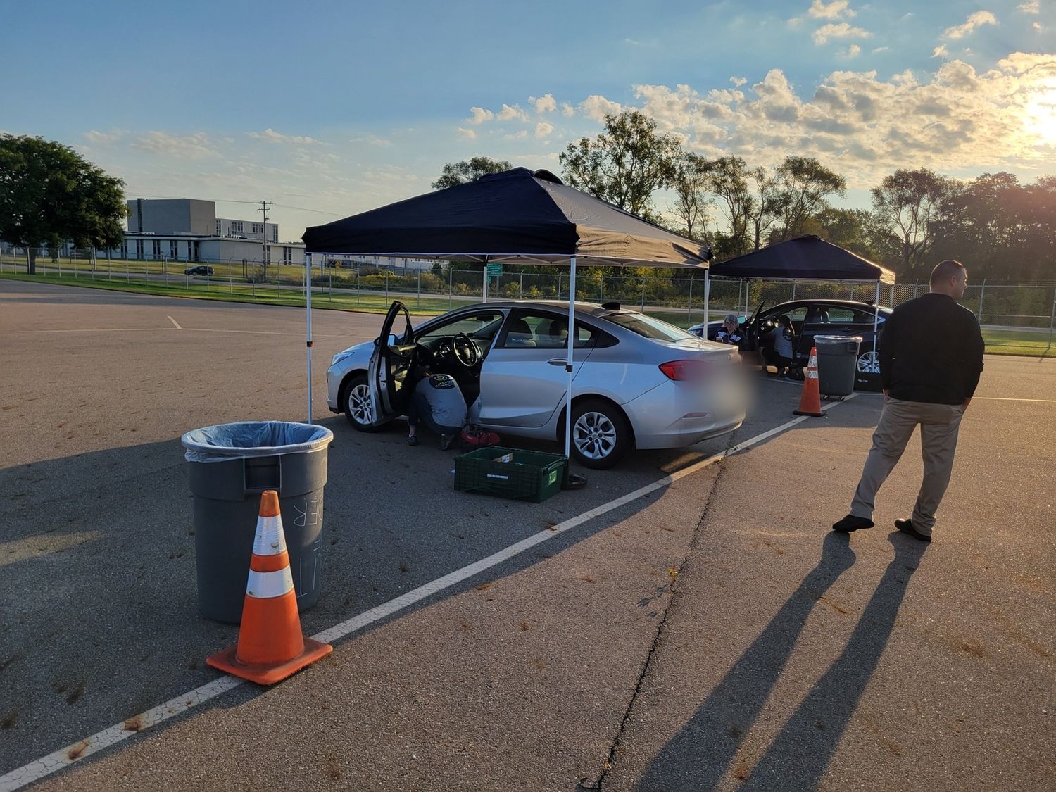 R-Tech Guys mobile install setup with canopies and multiple fleet vehicles staged in a parking lot